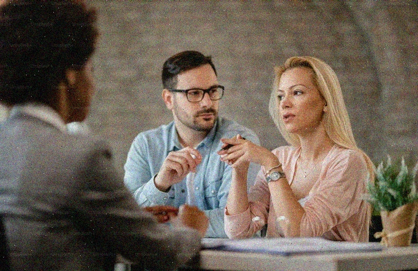 professional financial advisor meeting couple